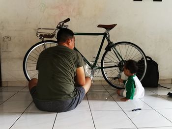 Boy sitting on bicycle