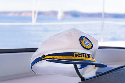 Close-up of yellow sailboat sailing in sea