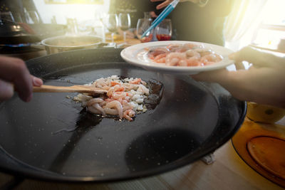 Close-up of person preparing food in kitchen