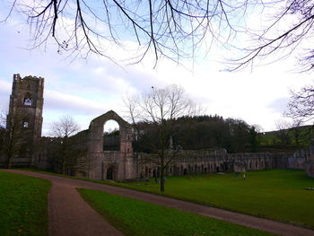 View of cemetery against cloudy sky