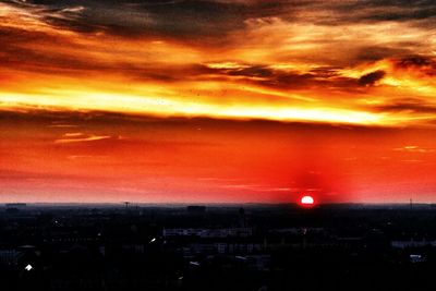 Dramatic sky over city during sunset