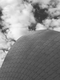 Low angle view of building against cloudy sky