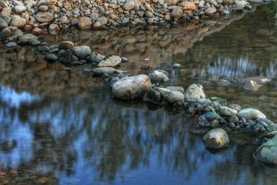 Reflection of rocks in water