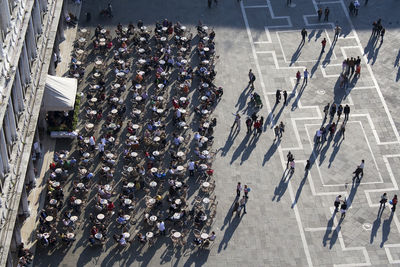 High angle view of people at sidewalk cafe in city