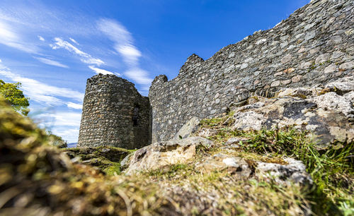 Low angle view of old ruins against sky