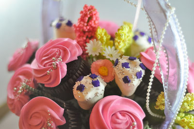 Bouquet of cupcake and marshmallows in basket. a gift on valentines day, birthday and anniversary.