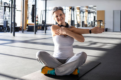 Low section of woman exercising in gym