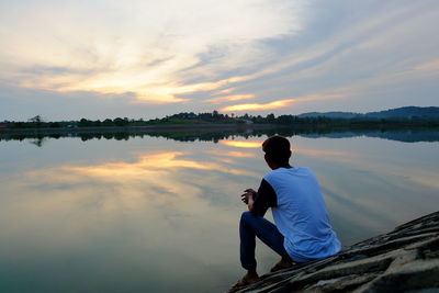 Scenic view of lake at sunset