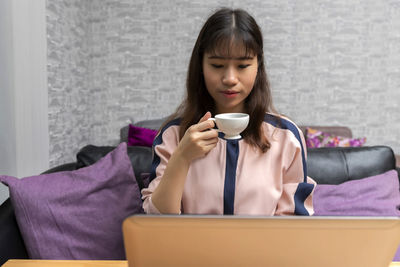 Young woman using mobile phone