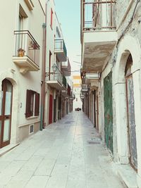 Narrow alley amidst buildings in town