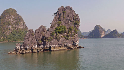 Rock formation at ha long bay against sky