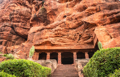 Badami cave temple interior pillars stone art in details