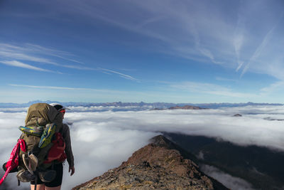 Man on mountain against sky