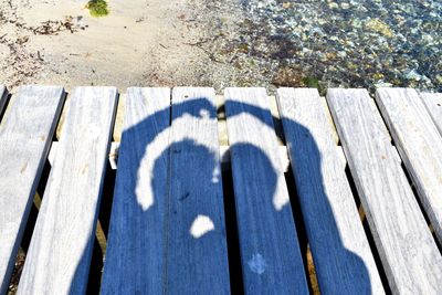 High angle view of shadow on wooden table