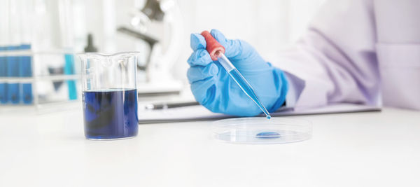 Scientist examining chemical in laboratory