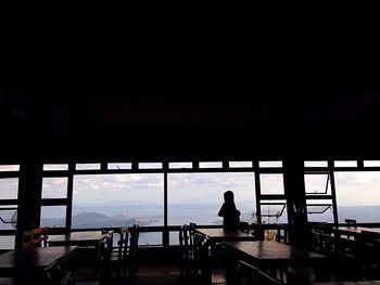 Silhouette people at seaside