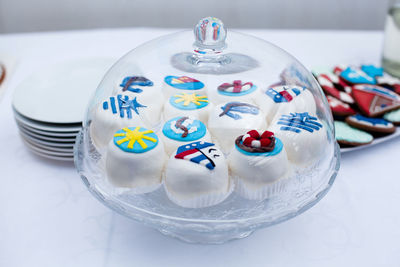 Beautiful little cookies with a nautical theme, anchor, ships under a glass cover