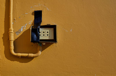 The old rusty electrical switch on a wall