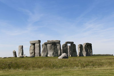 Built structure on field against sky