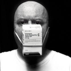 Close-up portrait of a man holding camera