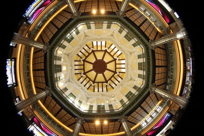 Low angle view of illuminated building at night