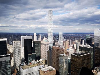 Modern buildings in city against sky