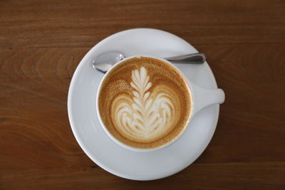 Close-up of cappuccino served on table