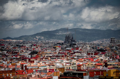 High angle view of townscape against cloudy sky