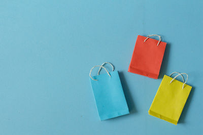 High angle view of colored pencils against blue background