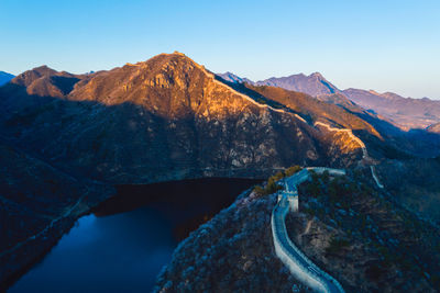 Scenic view of snowcapped mountains against clear sky