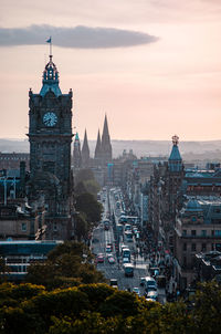 Clock tower in city against sky