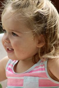 Close-up portrait of cute girl looking away