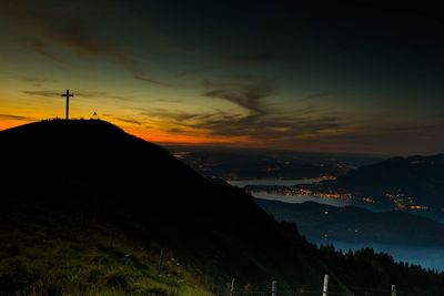 Scenic view of silhouette mountains against sky during sunset