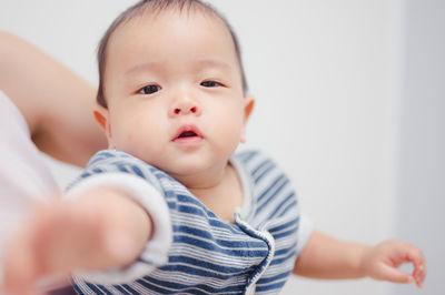 Portrait of cute baby at home