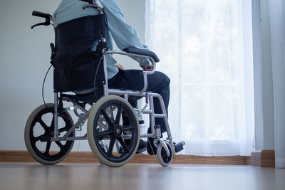 Man sitting on window sill