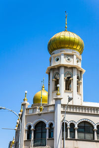 Low angle view of church against clear blue sky