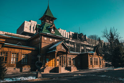 Exterior of old building against clear blue sky