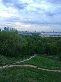 Scenic view of green landscape against sky