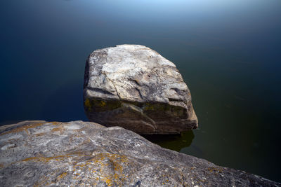 Close-up of rock formation in lake