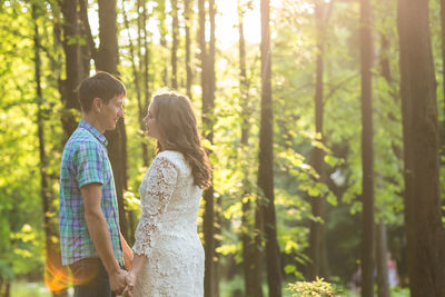 Young couple standing in forest