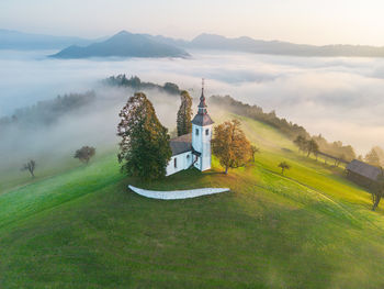 Aerial drone shot of sveti tomaž church in Škofja loka in slovenia