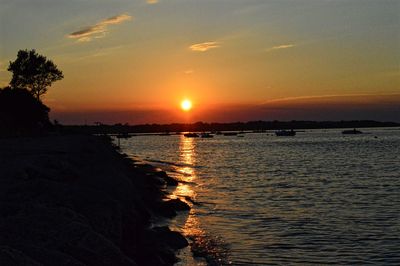 Scenic view of sea at sunset