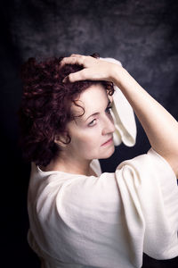 Portrait of red-haired woman in white blouse vii