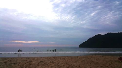 Scenic view of sea against cloudy sky