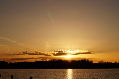 View of calm lake at sunset