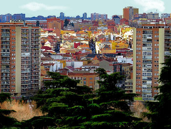 Buildings in city against sky