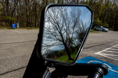 Reflection of car on side-view mirror