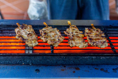 Close-up of meat on barbecue grill