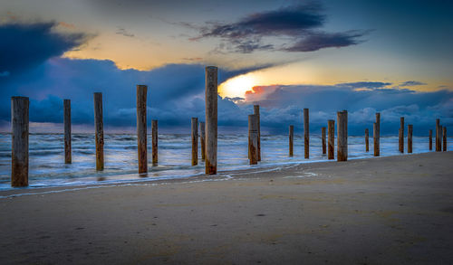 View of poles at calm beach