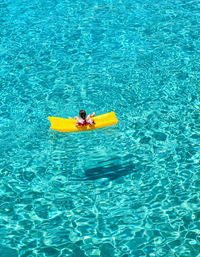 Yellow inflatable mattress at blue lagoon, malta